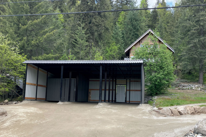 Custom residential 3-Bay parking structure with lockup area and man door built in Revelstoke, BC
